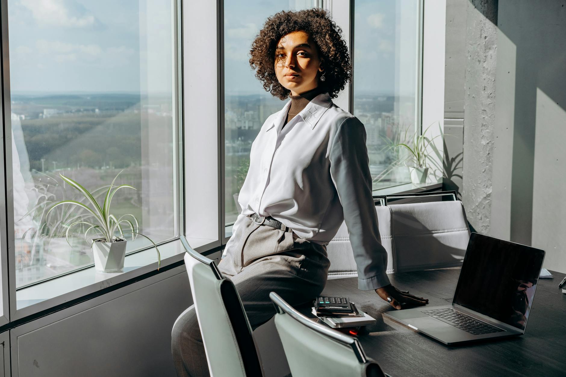 a woman sitting on her desk